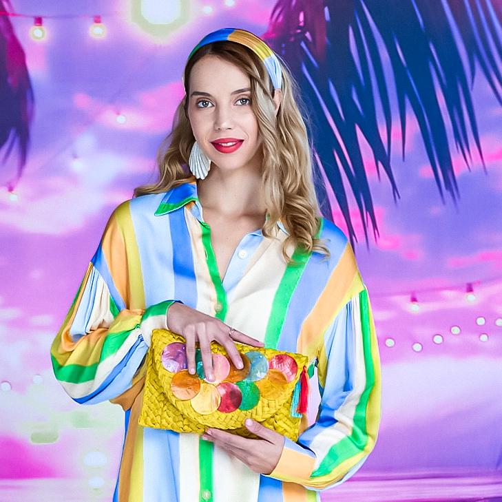 Yellow straw clutch adorned multicolour sea shell discs