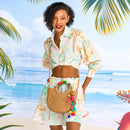 Straw clutch with shell and tassels and crab applique on the reverse