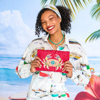 Straw clutch with shell and tassels and crab applique on the reverse